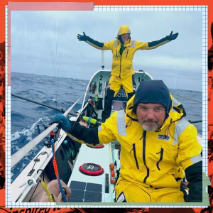 2 HPP team members on the boat wearing yellow rain gear